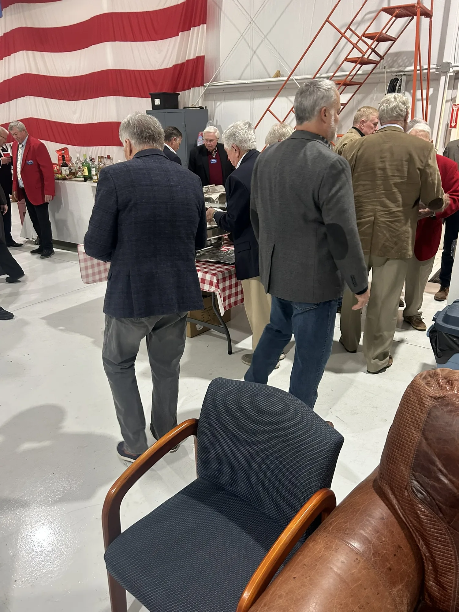 Guests at a corporate event buffet line