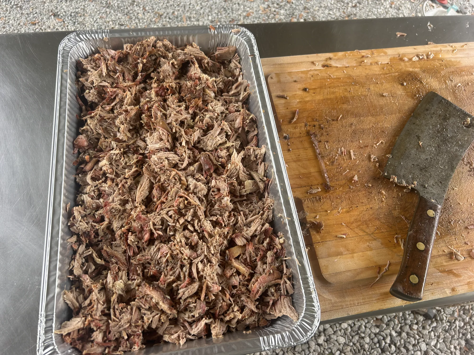 Pulled pork shredded on a cutting board
